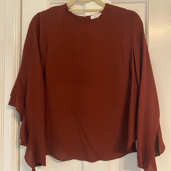 ALC rust color blouse with open back and ruffle sleeves. - Picture 1 of 3